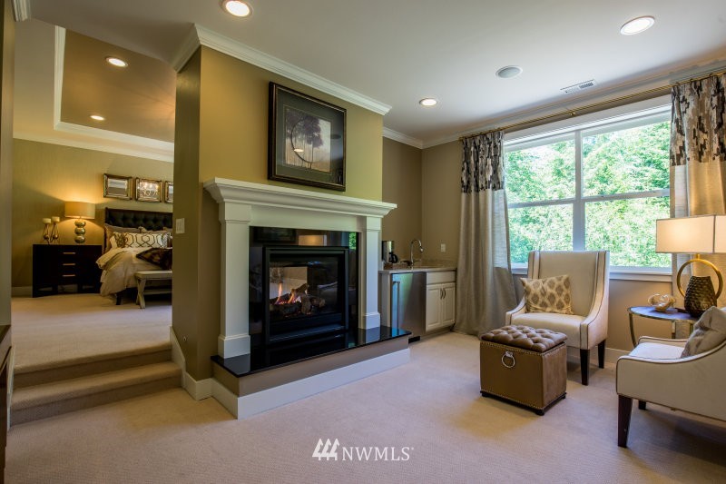 5629 196th Street Southeast, Unit 32 Bothell, WA 98012 - Photo 22 of 25 a living room with furniture and a fireplace