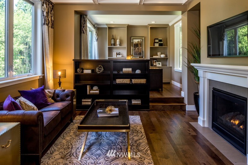 5629 196th Street Southeast, Unit 32 Bothell, WA 98012 - Photo 4 of 25 a living room with furniture and a fireplace