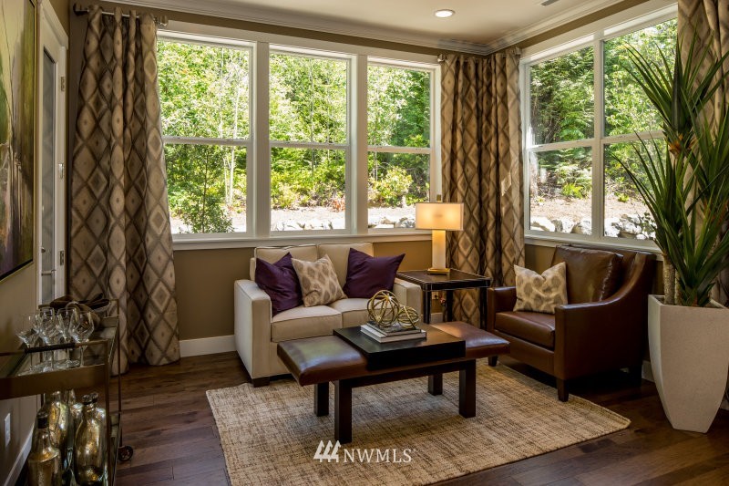 5629 196th Street Southeast, Unit 32 Bothell, WA 98012 - Photo 7 of 25 a living room with furniture and a potted plant