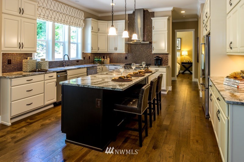 5629 196th Street Southeast, Unit 32 Bothell, WA 98012 - Photo 8 of 25 a kitchen with sink cabinets and wooden floor