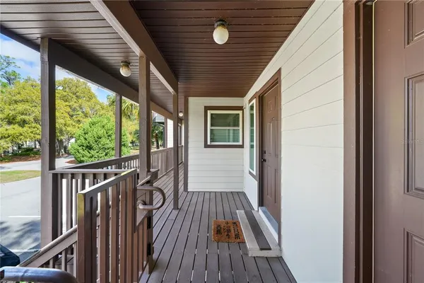 a view of balcony with wooden floor