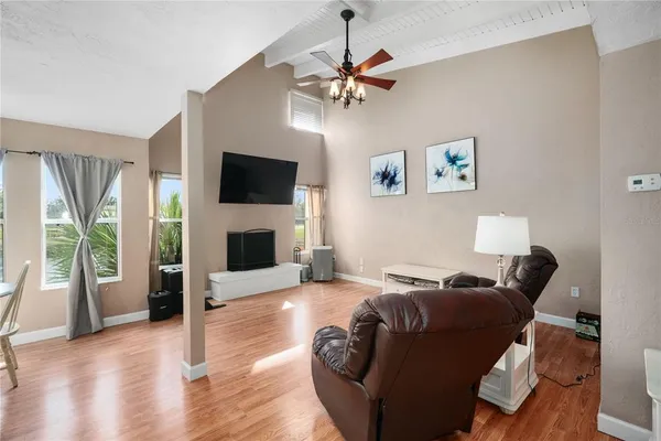 a living room with furniture and a flat screen tv