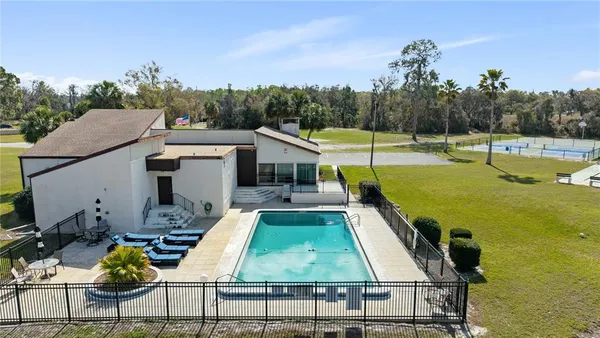 a view of a swimming pool with a patio
