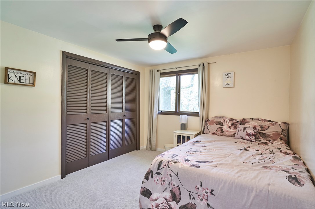 1535 Belle Meade Drive Akron, OH 44321 - Photo 10 of 33 Bedroom 1 with newer paint , ceiling fan and caroet