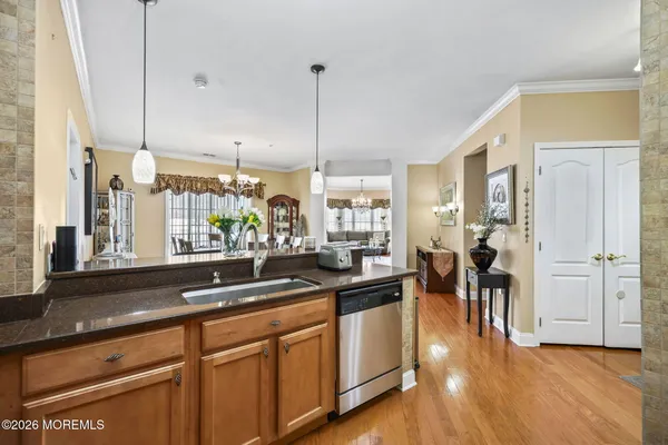 a kitchen with lots of counter top space and wooden floor