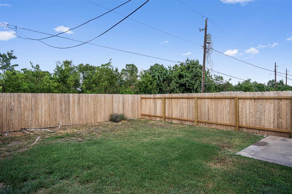 13357 Water Oak Lane, Unit B Austin, TX 78729 - Photo 25 of 26 a backyard of a house with lots of green space
