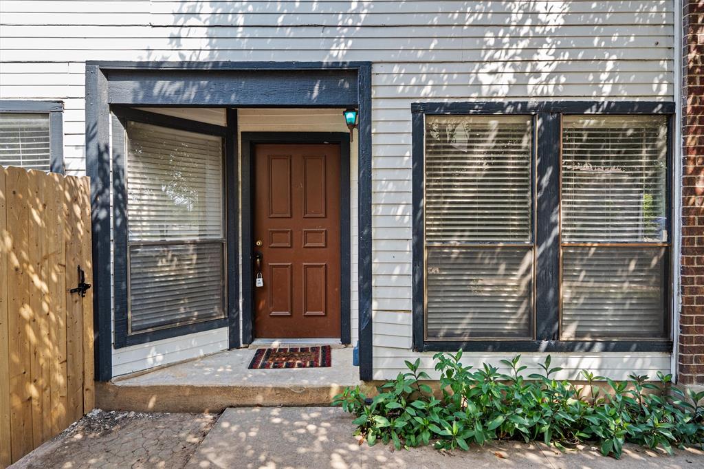 13357 Water Oak Lane, Unit B Austin, TX 78729 - Photo 3 of 26 a front view of a house with a yard