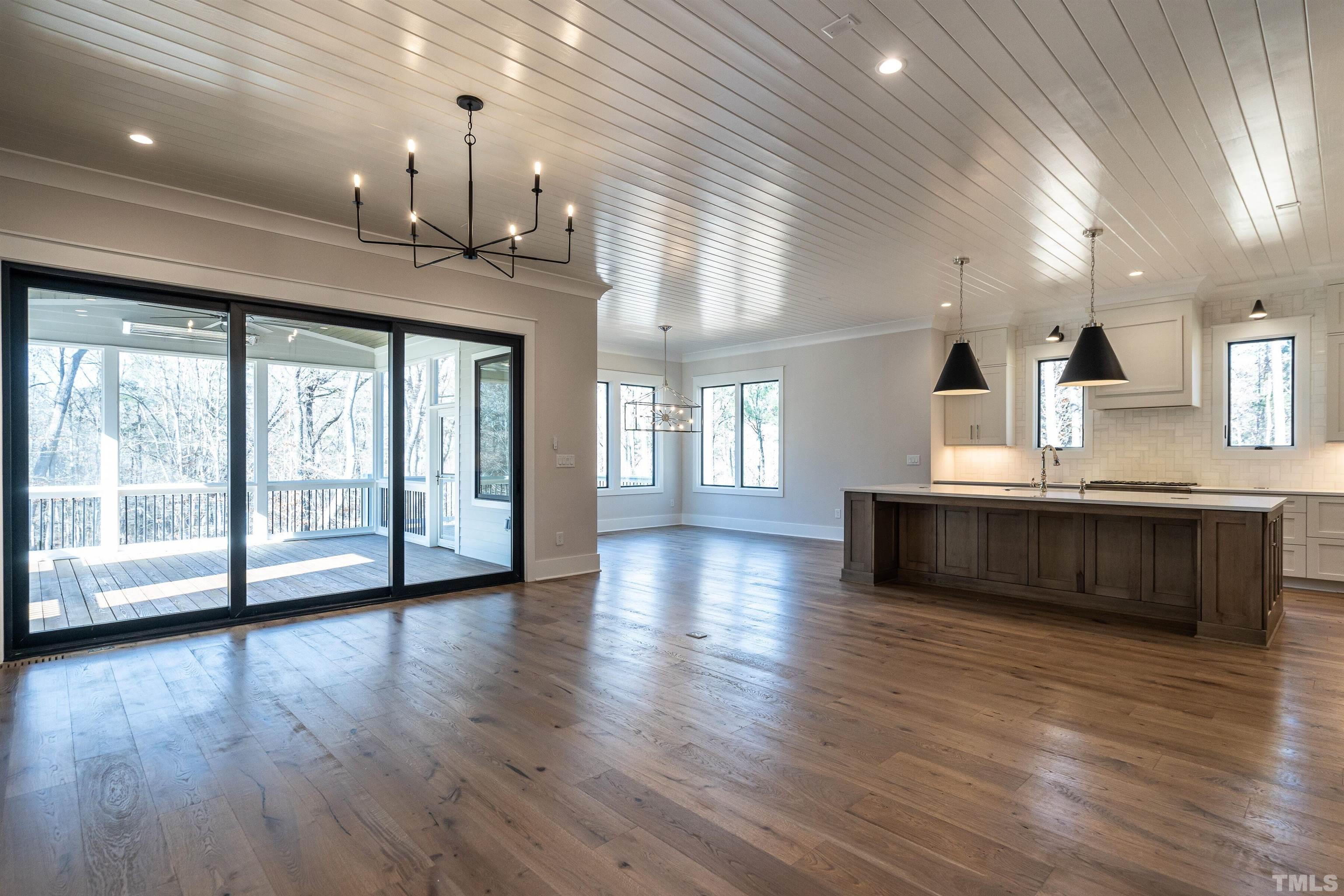 5425 Winding View Lane Raleigh, NC 27615 - Photo 17 of 54 a view of an empty room with wooden floor and a window
