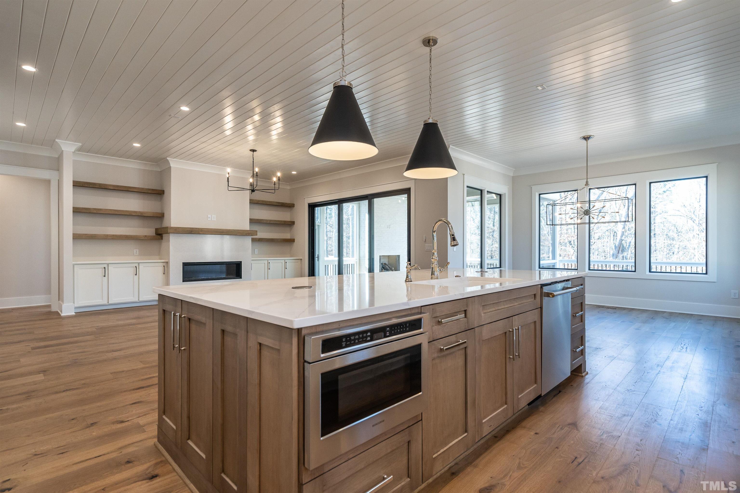 5425 Winding View Lane Raleigh, NC 27615 - Photo 23 of 54 a kitchen with stainless steel appliances granite countertop a stove and a wooden floors