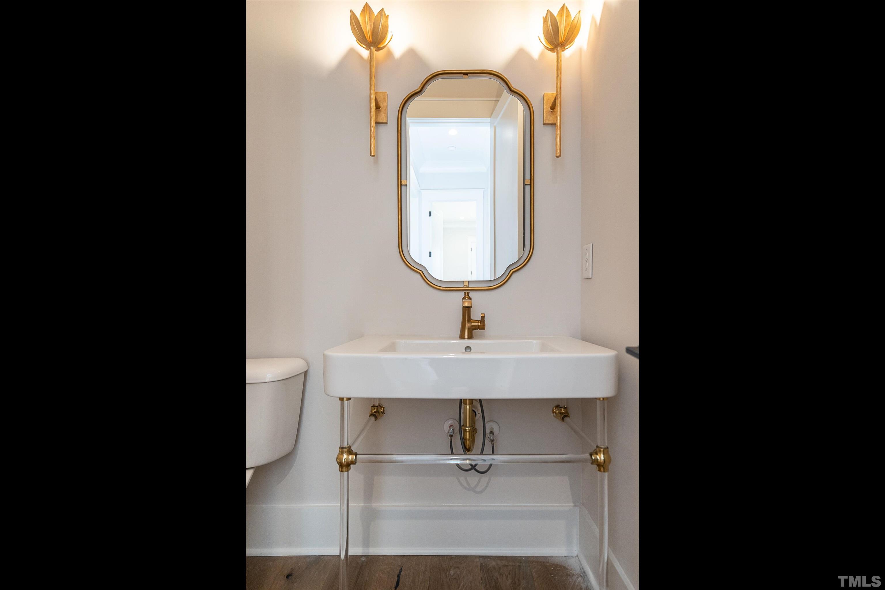 5425 Winding View Lane Raleigh, NC 27615 - Photo 27 of 54 a bathroom with a sink and a mirror
