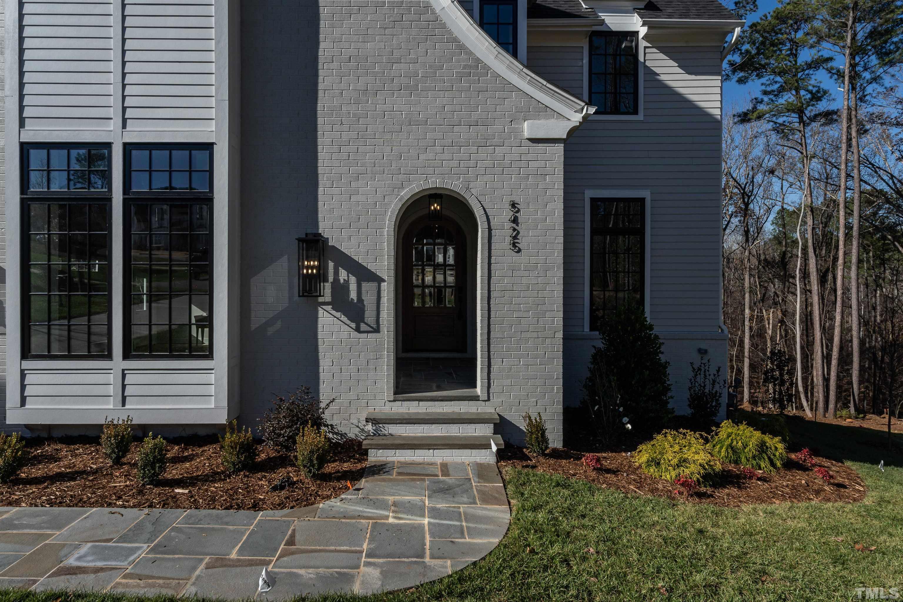 5425 Winding View Lane Raleigh, NC 27615 - Photo 3 of 54 a front view of a house with a garden