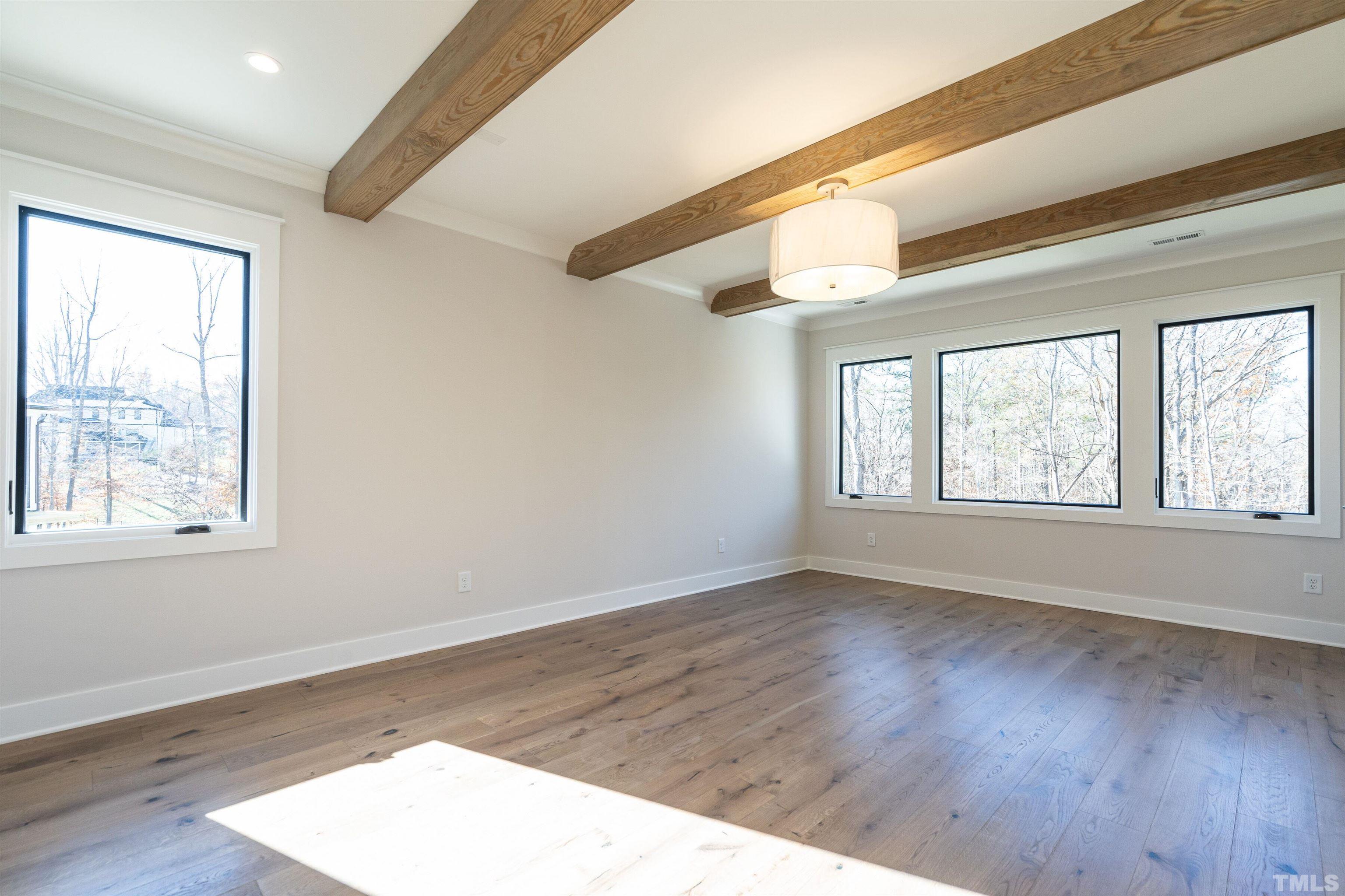 5425 Winding View Lane Raleigh, NC 27615 - Photo 31 of 54 a view of an empty room with wooden floor and a window