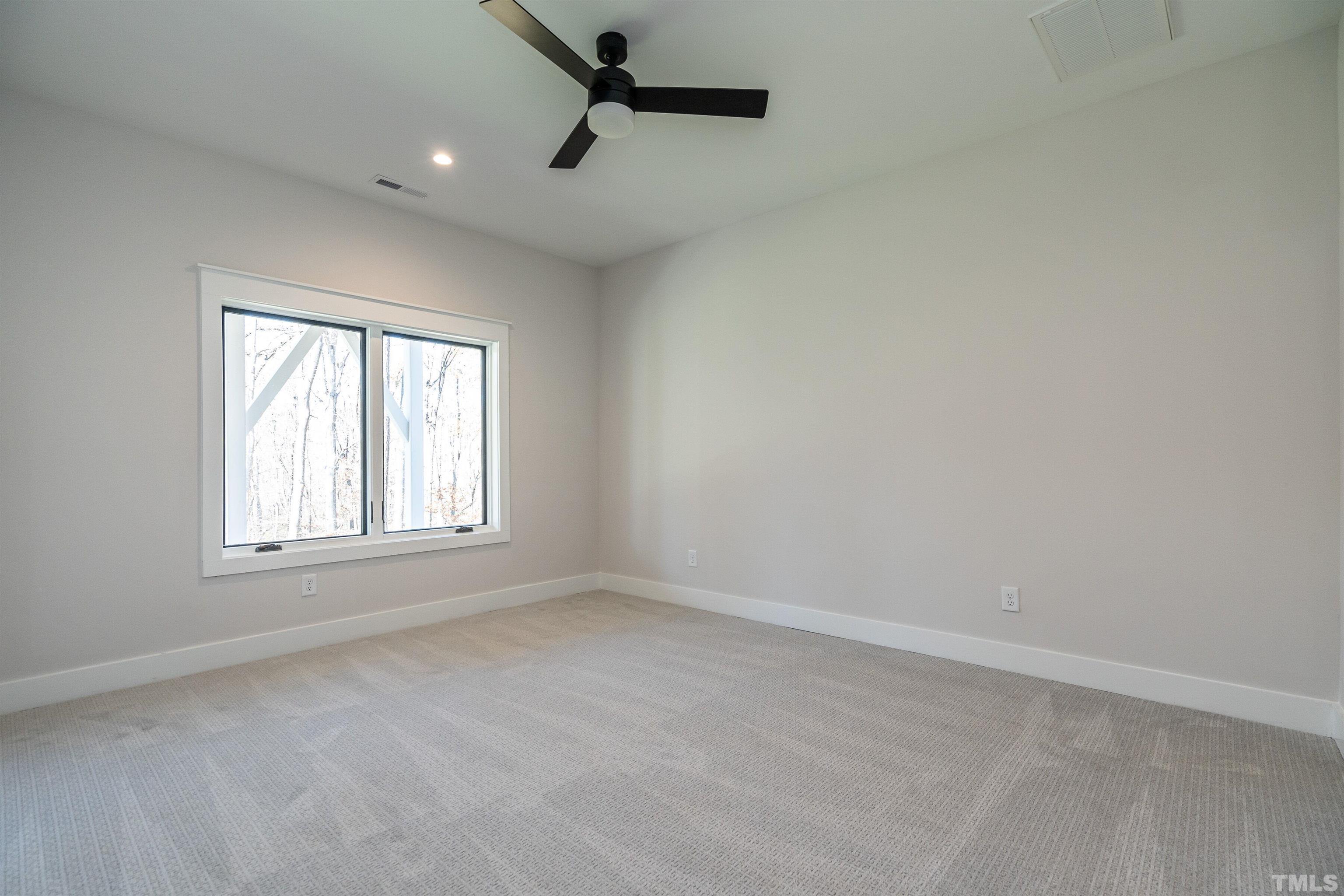 5425 Winding View Lane Raleigh, NC 27615 - Photo 48 of 54 an empty room with a window
