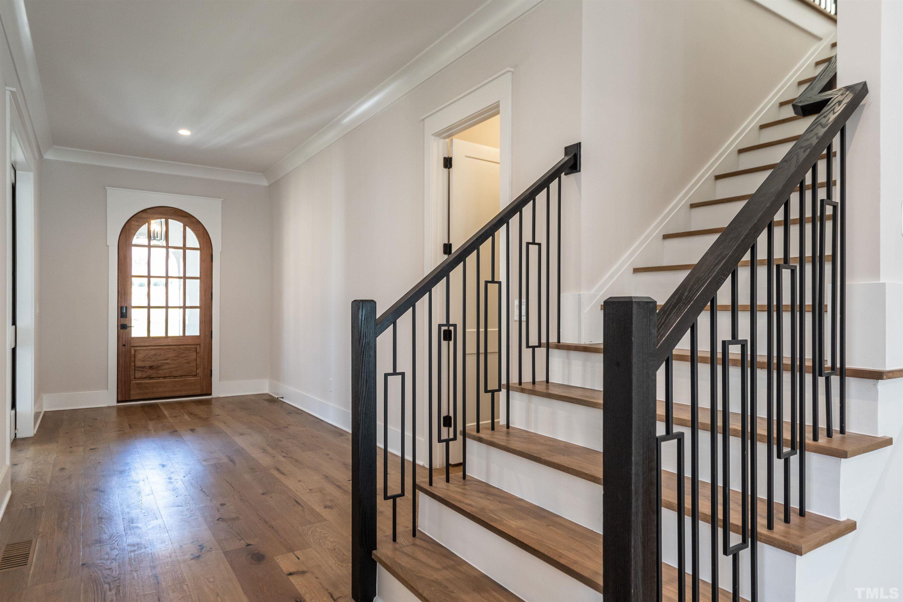 5425 Winding View Lane Raleigh, NC 27615 - Photo 8 of 54 a view of an entryway with wooden floor and door
