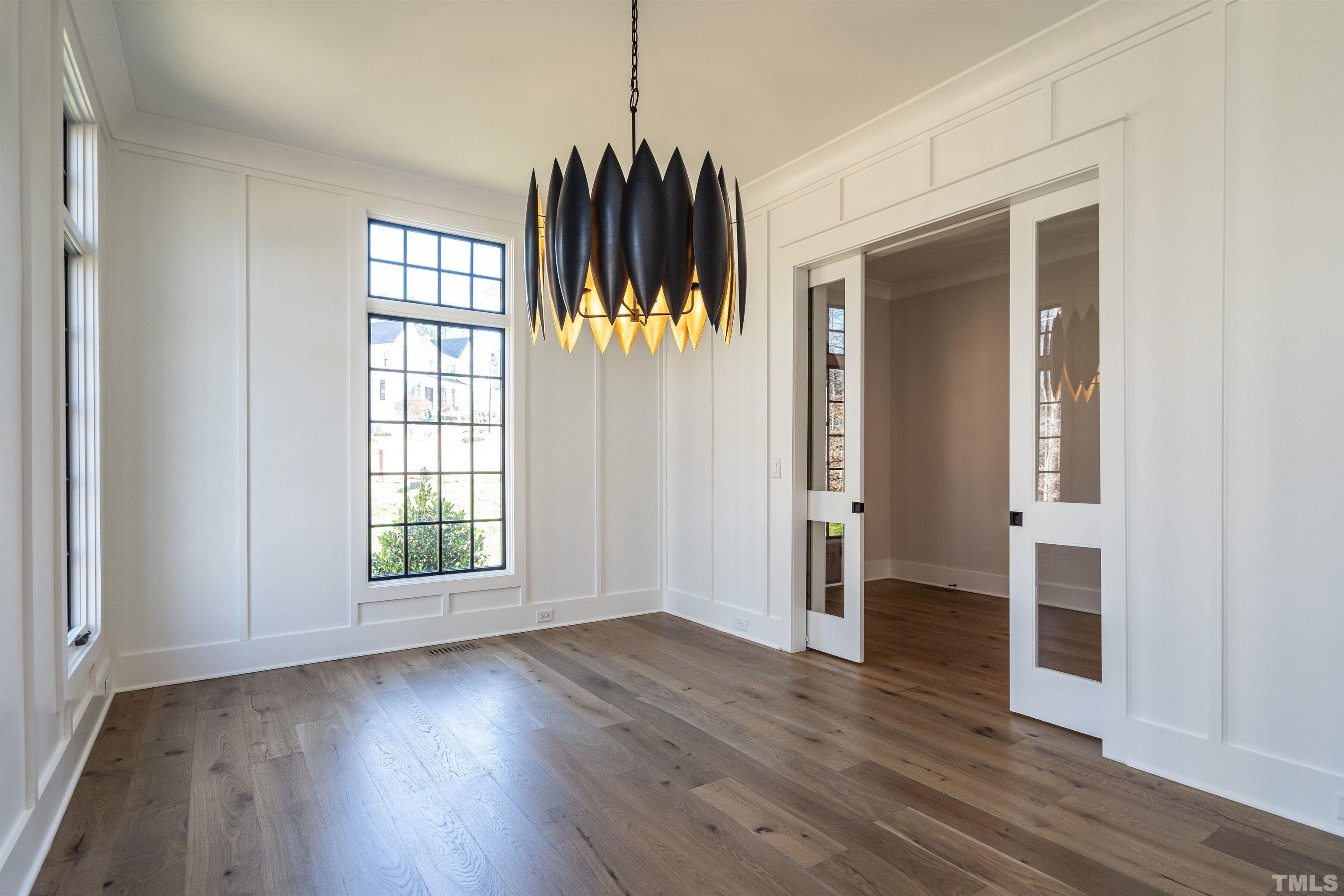 5425 Winding View Lane Raleigh, NC 27615 - Photo 10 of 54 an empty room with wooden floor and a window