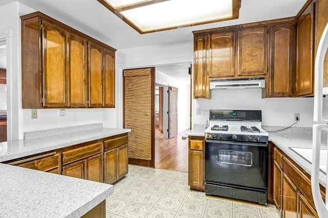 a spacious bathroom with a double vanity sink a mirror and a bathtub