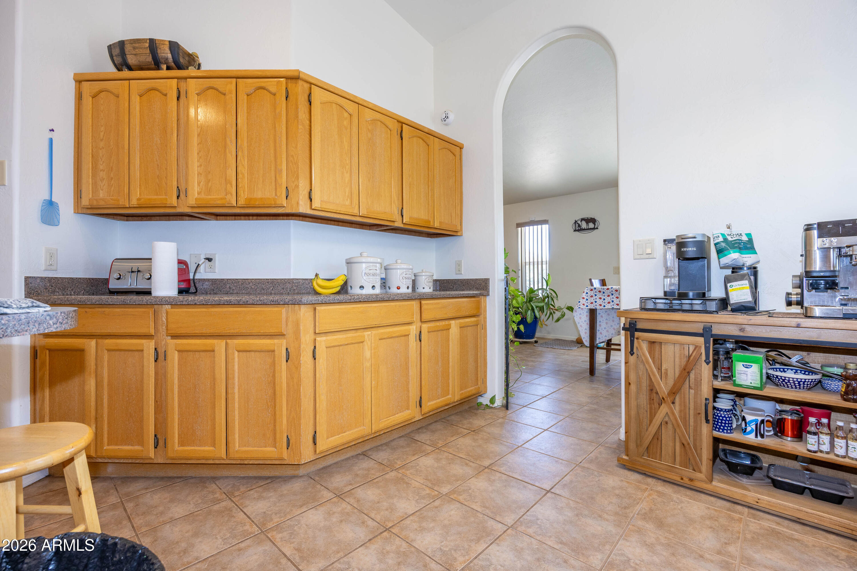 4575 South Kino Road Sierra Vista, AZ 85650 - Photo 18 of 25 a kitchen with stainless steel appliances granite countertop a sink a stove and cabinets