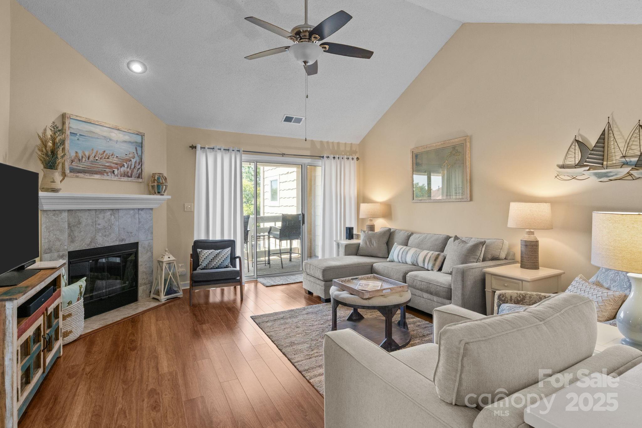 18009 Kings Point Drive, Unit I Cornelius, NC 28031 - Photo 16 of 47 a living room with furniture and a fireplace