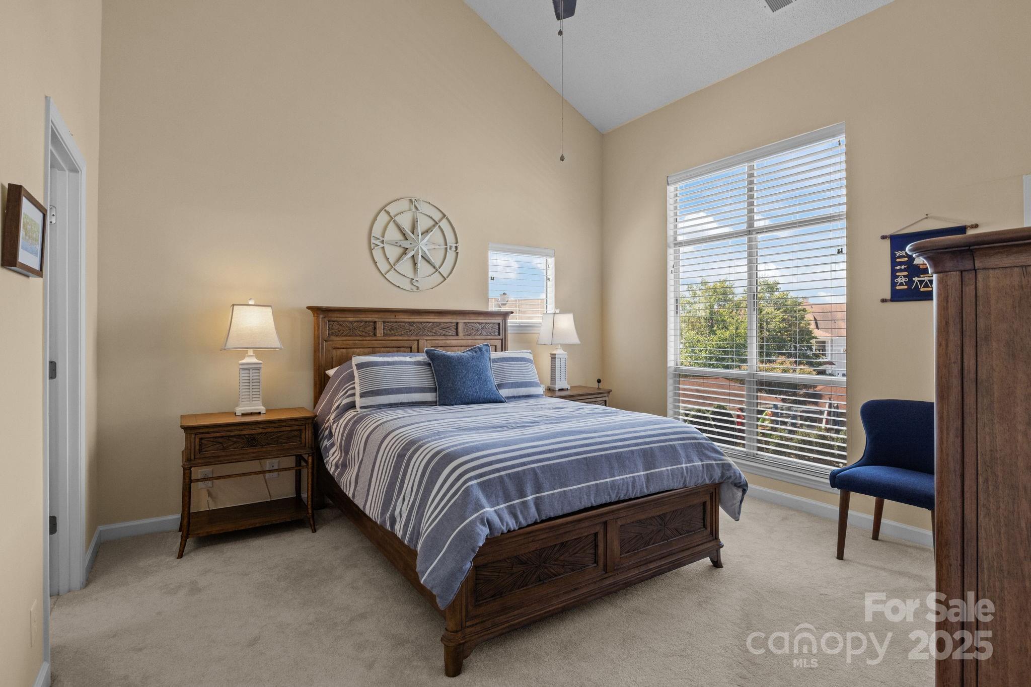 18009 Kings Point Drive, Unit I Cornelius, NC 28031 - Photo 19 of 47 a bedroom with a bed and window