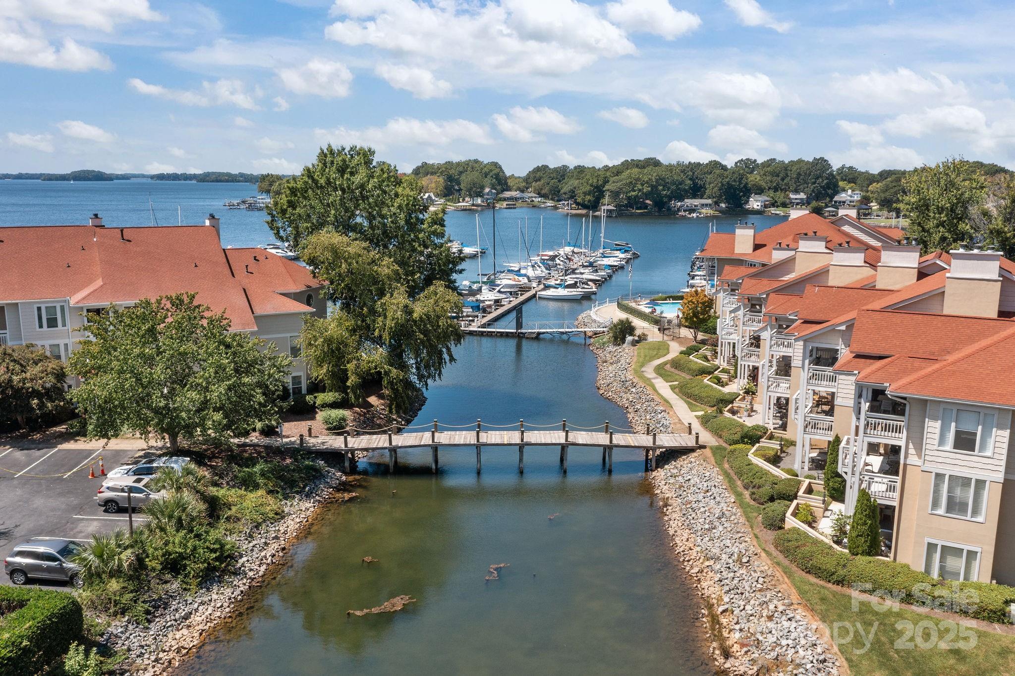 18009 Kings Point Drive, Unit I Cornelius, NC 28031 - Photo 2 of 47 an aerial view of residential houses with outdoor space and ocean view