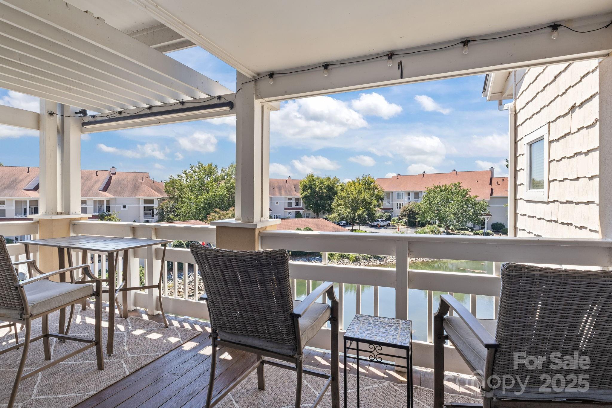 18009 Kings Point Drive, Unit I Cornelius, NC 28031 - Photo 26 of 47 a view of a city from a dining room