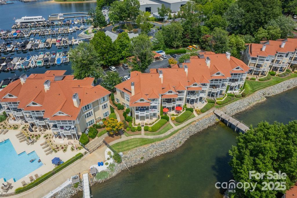 18009 Kings Point Drive, Unit I Cornelius, NC 28031 - Photo 29 of 47 an aerial view of residential houses with outdoor space and lake view