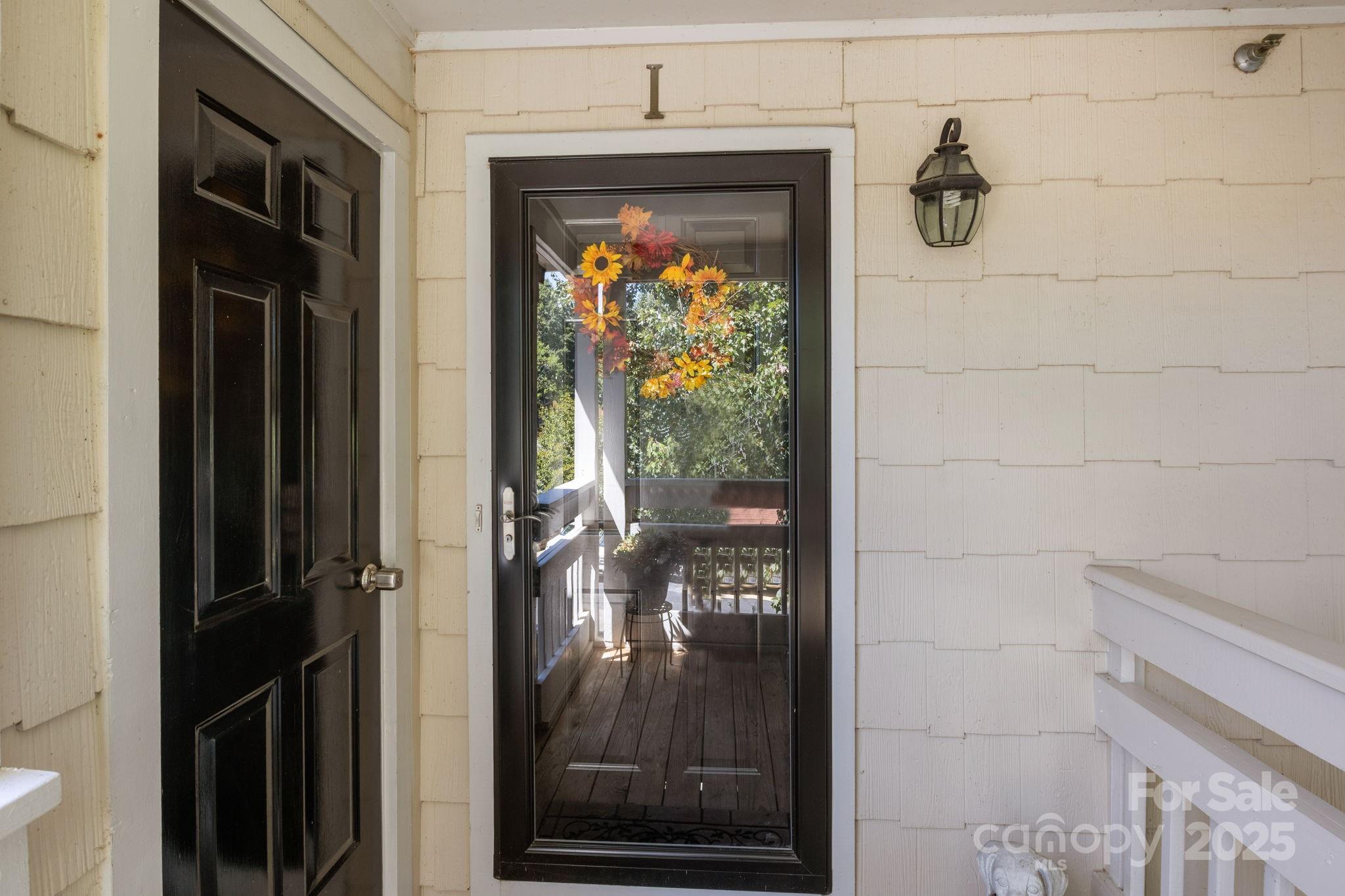 18009 Kings Point Drive, Unit I Cornelius, NC 28031 - Photo 3 of 47 a view of a porch of a house