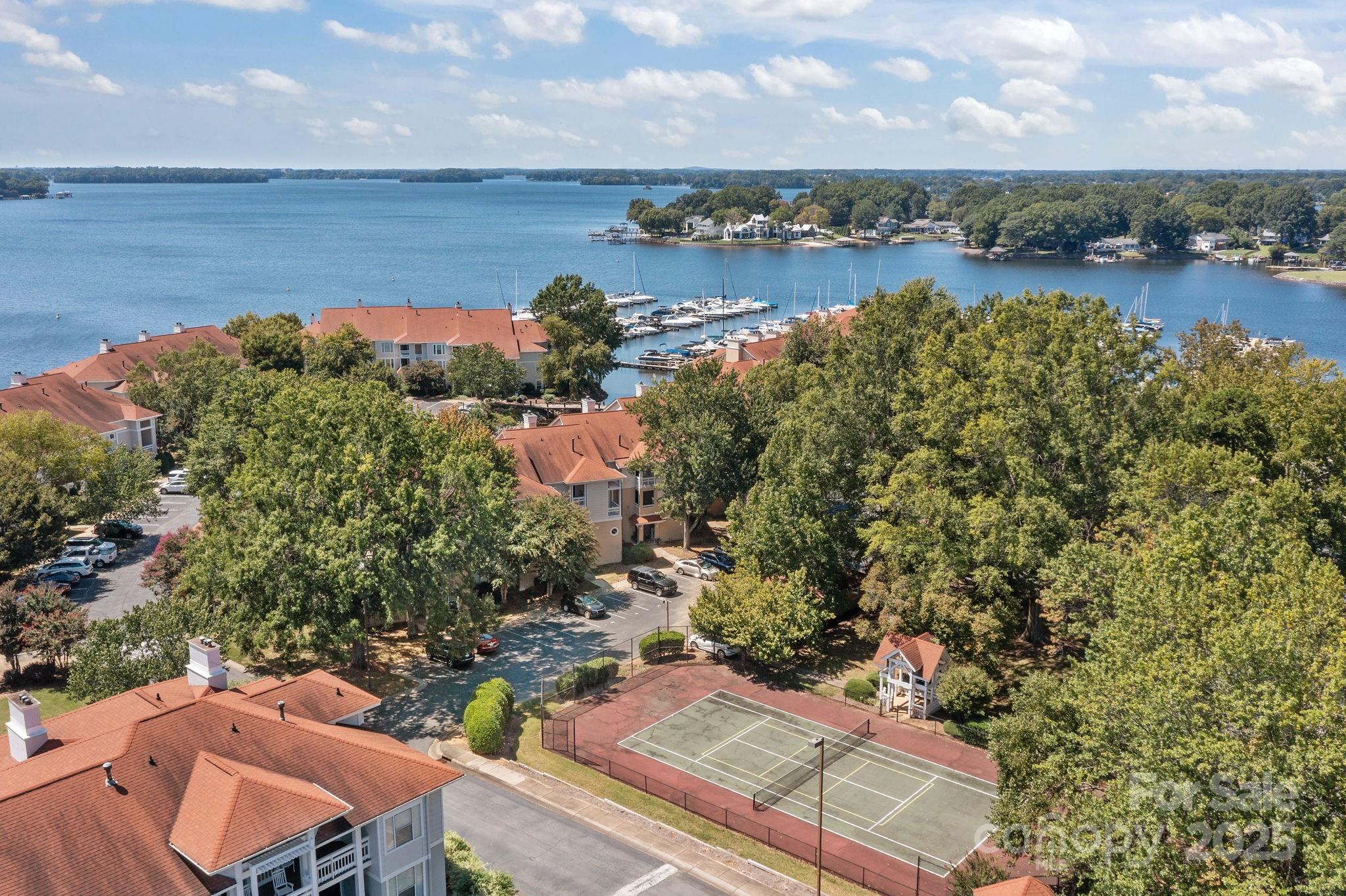 18009 Kings Point Drive, Unit I Cornelius, NC 28031 - Photo 34 of 47 an aerial view of a house with a lake view