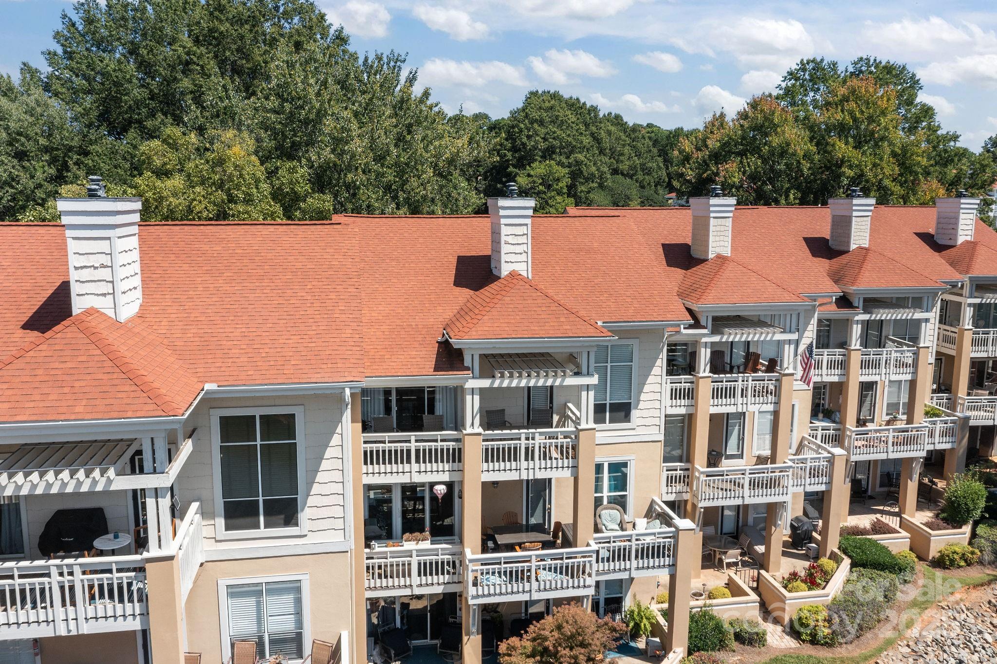 18009 Kings Point Drive, Unit I Cornelius, NC 28031 - Photo 36 of 47 an aerial view of residential houses with outdoor space and trees