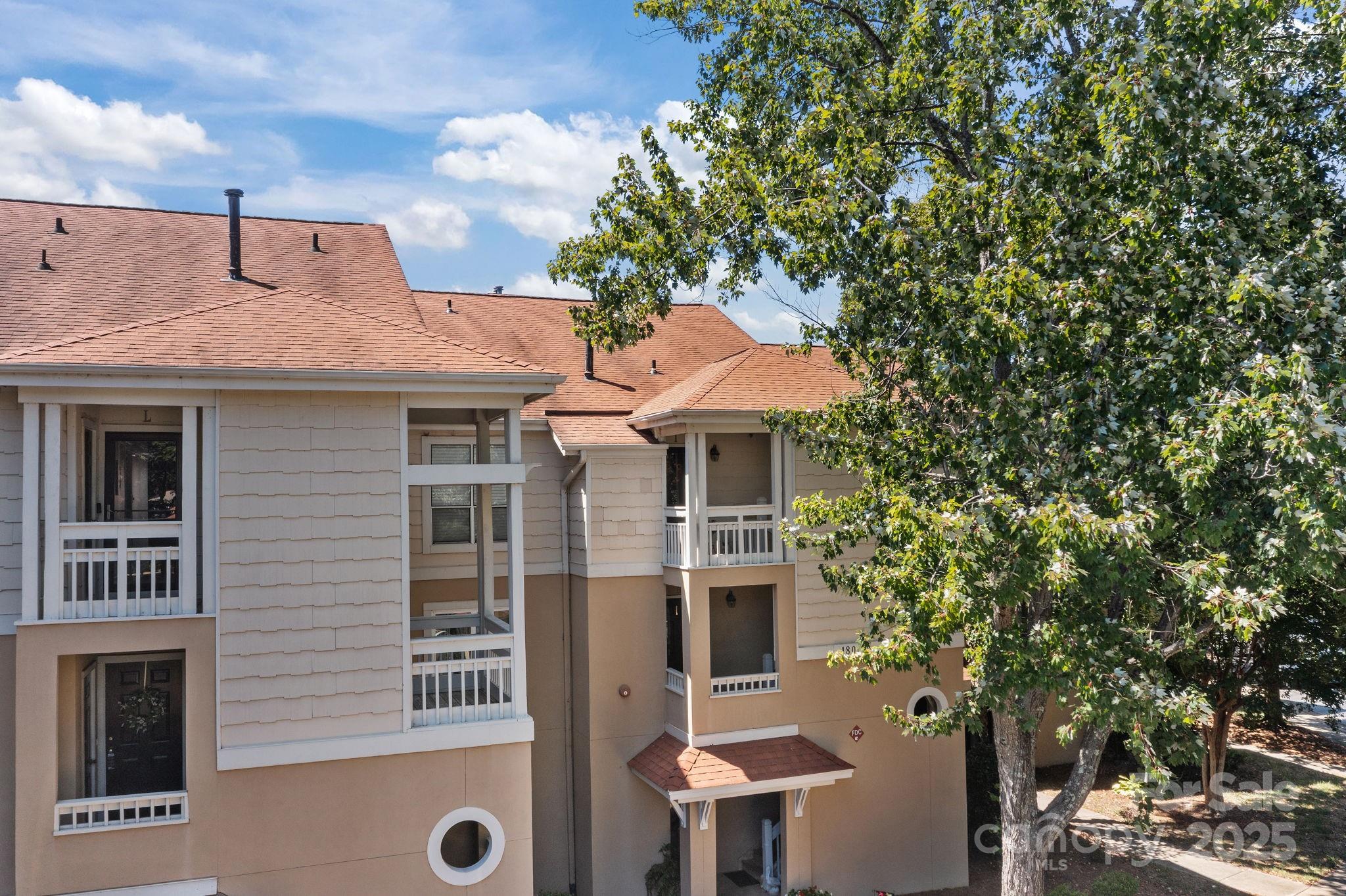 18009 Kings Point Drive, Unit I Cornelius, NC 28031 - Photo 39 of 47 a front view of a house with a yard