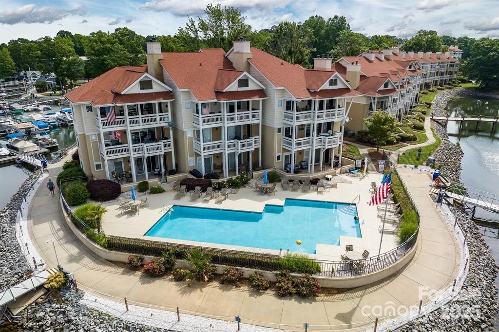 18009 Kings Point Drive, Unit I Cornelius, NC 28031 - Photo 40 of 47 a view of a house with swimming pool and furniture