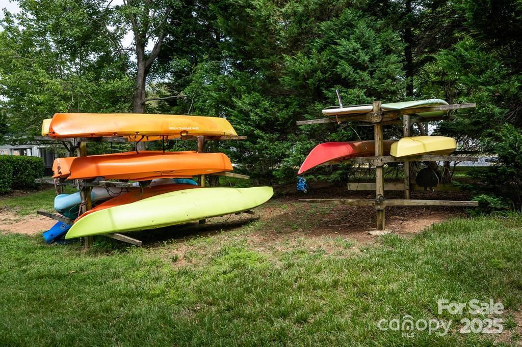 18009 Kings Point Drive, Unit I Cornelius, NC 28031 - Photo 44 of 47 a backyard of a house with table and chairs