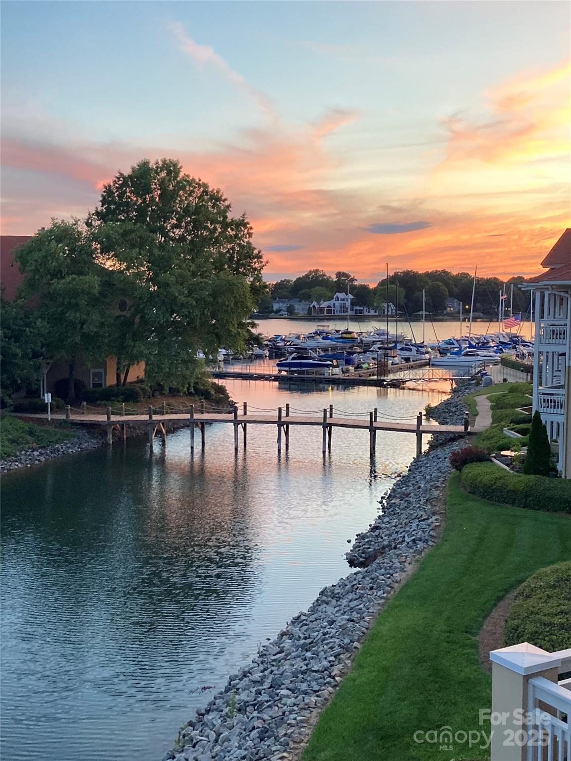 18009 Kings Point Drive, Unit I Cornelius, NC 28031 - Photo 47 of 47 a view of a water pond with lots of trees in the background