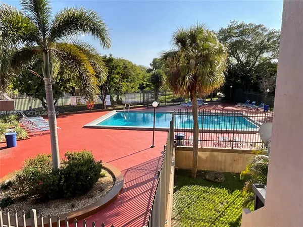 a view of a swimming pool with a patio