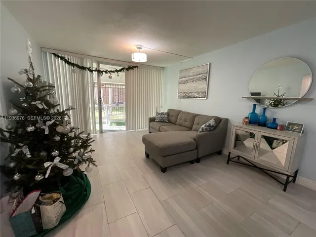 a large bed sitting in a bedroom and a flat tv screen or dressers