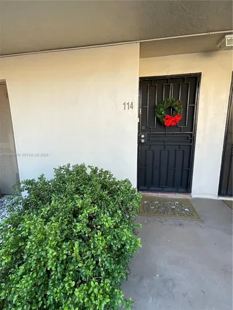 a view of a wooden door in front of a door