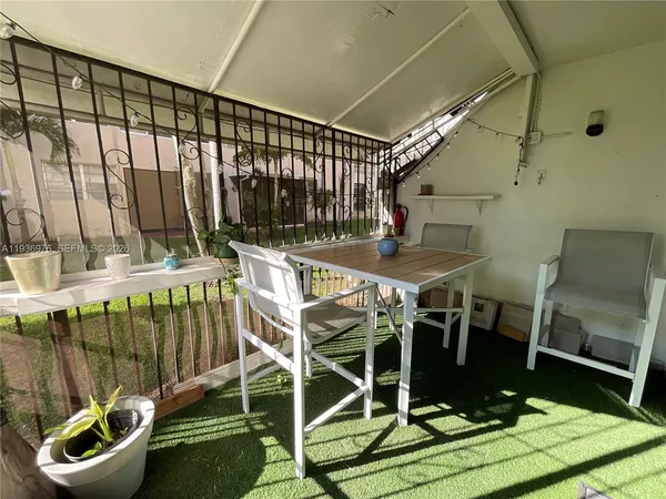 a view of a house with swimming pool and a yard