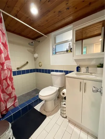 a bedroom with a bed and cabinets