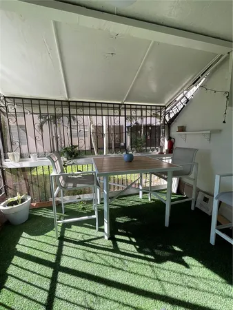 a spacious bedroom with a bed and a cabinets