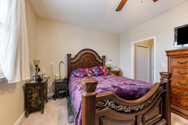 a bedroom with a bed and a dresser