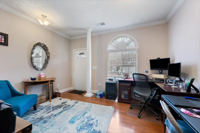 a workspace with furniture and a window
