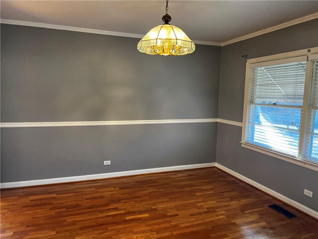 606 Pisgah Way Calhoun, GA 30701 - Photo 5 of 18 en empty room with window and wooden floor