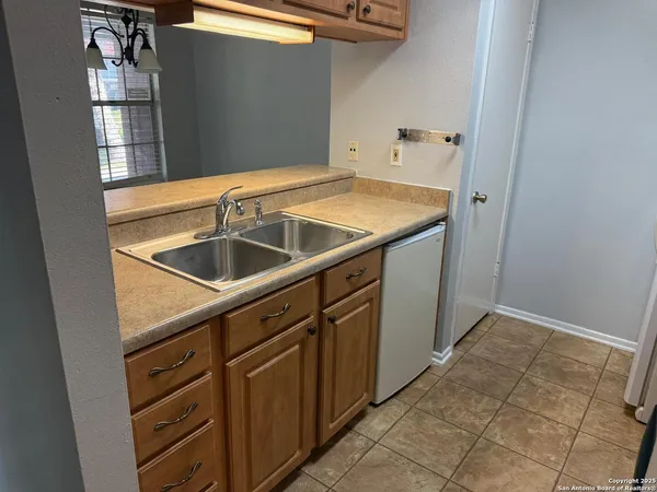 a close view of a sink and an umbrella