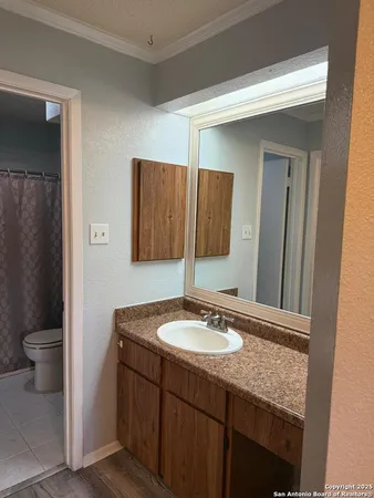 a white bath tub sitting next to a toilet