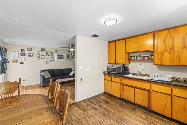 a kitchen with stainless steel appliances granite countertop a stove and a refrigerator