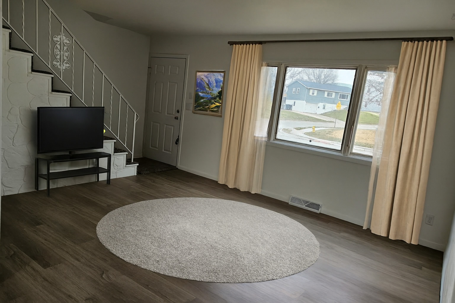 3424 Kimberly Downs Road Davenport, IA 52807 - Photo 3 of 11 an empty room with wooden floor and windows