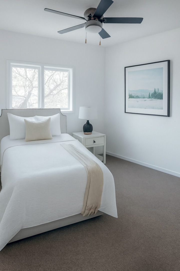3424 Kimberly Downs Road Davenport, IA 52807 - Photo 7 of 11 a bedroom with a bed and window