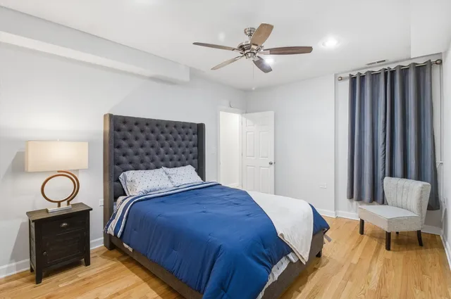 a bedroom with a bed and a table