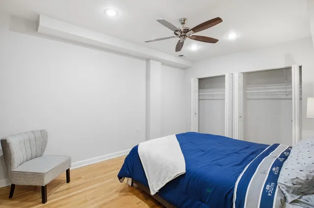 a bedroom with a bed and a chair