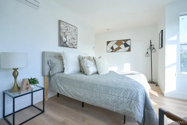 a bed room with a bed and a couch